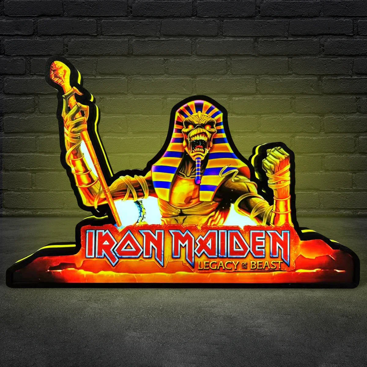 Iron Maiden logo with a pharaoh design on a dark background