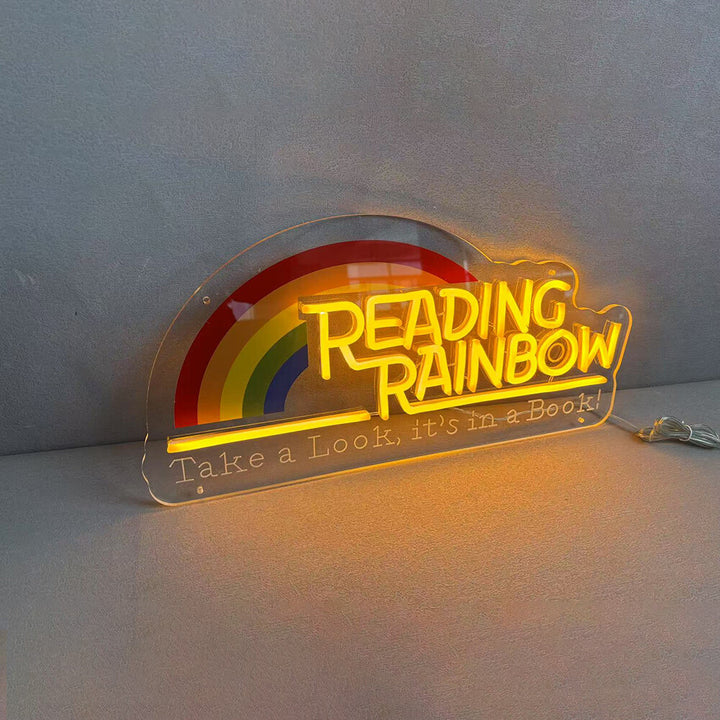 Leuchtreklame „Reading Rainbow“: Schau mal rein, es ist in einem Buch! (Schild für Lesesaal) 